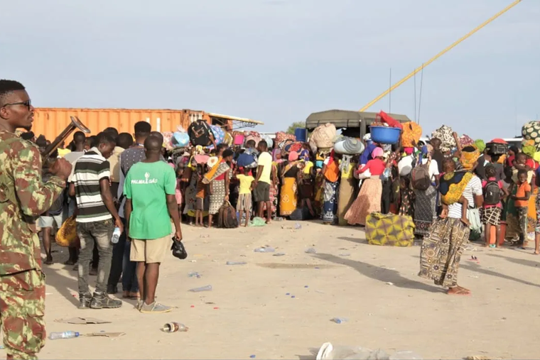 A group of women and children are guarded by security forces in Mucimboa da Praia of Mozambique’s Cabo Delgado Province in early September.
