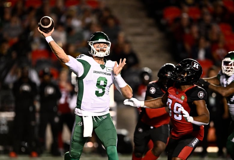 Saskatchewan Roughriders quarterback Jake Dolegala throwing the backk during the first half of the game on Friday.