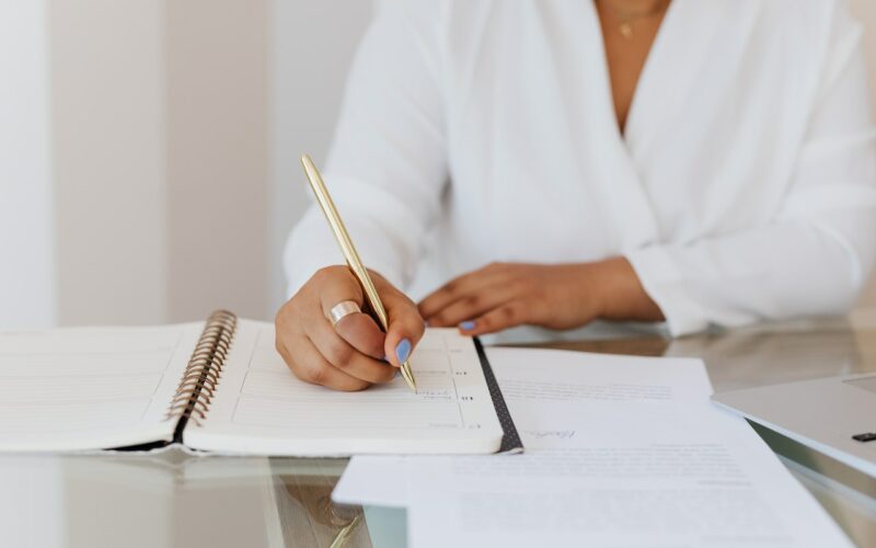 therapist-writing-in-planner-journal