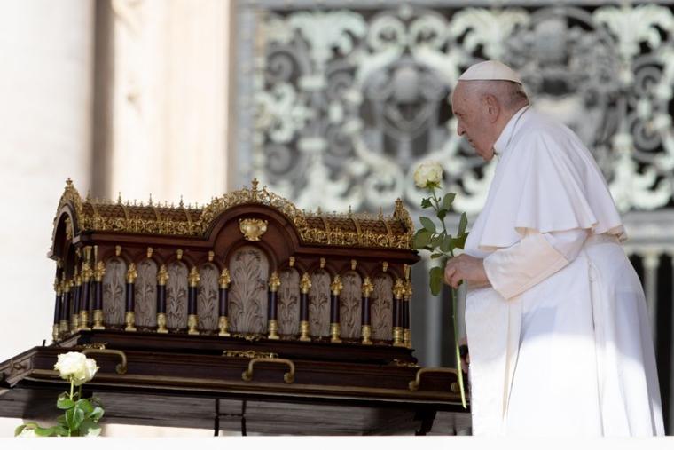 Pope Francis prayed before a relic of St. Therese of Lisieux at the beginning of his general audience in St. Peter's Square on June 7, 2023.