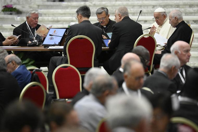 Pope Francis attends a roundtable discussion during the synod on Oct. 6.