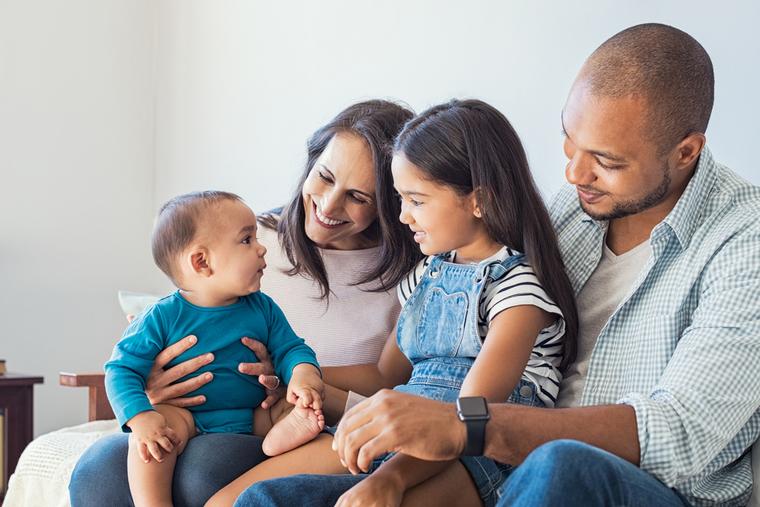 A young family spends a moment together at home.