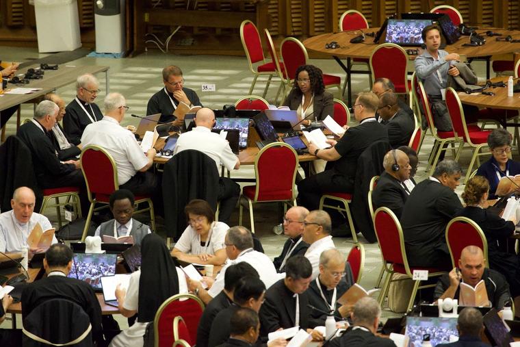 Synod participants listen in during table discussion at the Synod on Synodality at the Vatican October 2023.
