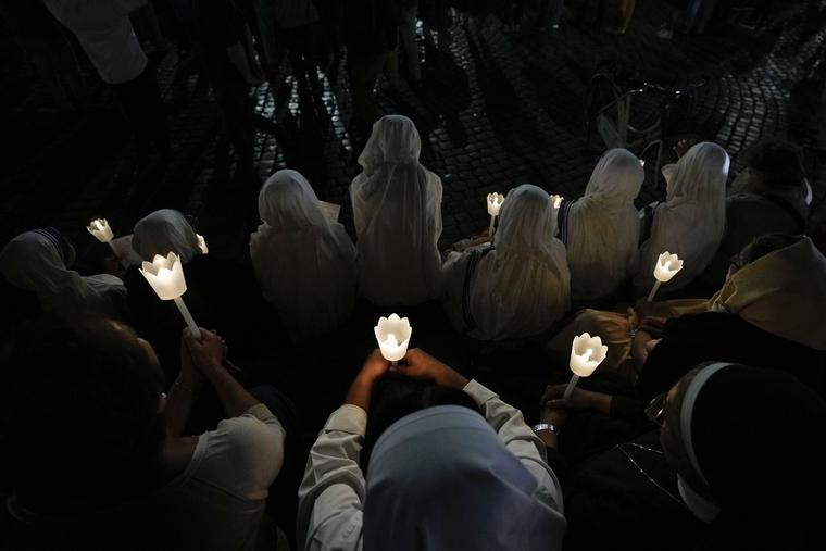 Faithful gather in front of the Vatican's Basilica of St. Mary Mayor in Rome, Sunday, Oct. 15, 2023, to lead a prayer for peace in the Middle East. A prayer vigil will take place at 6 p.m. in St. Peter’s Square on Oct. 27, where the faithful will join the Pope to participate in ‘an hour of prayer in a spirit of penance to implore peace in our time, peace in this world.’