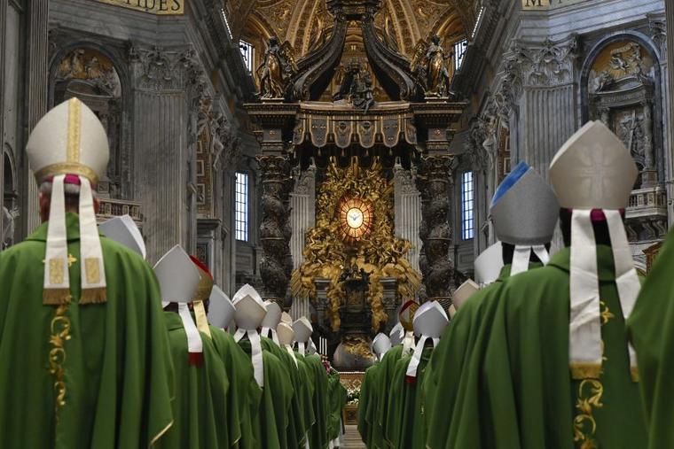 Bishops process into St. Peter’s Basilica for the closing Mass of the first assembly of the Synod on Synodality on Oct. 29.