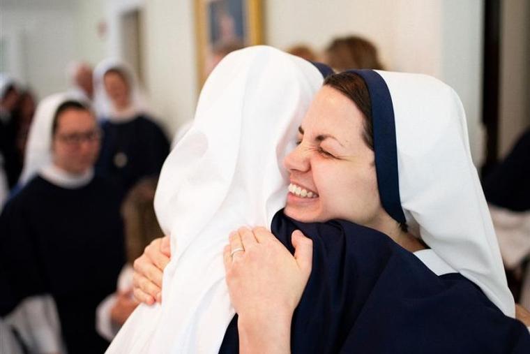 Two religious sisters in Sisters of Life embrace.