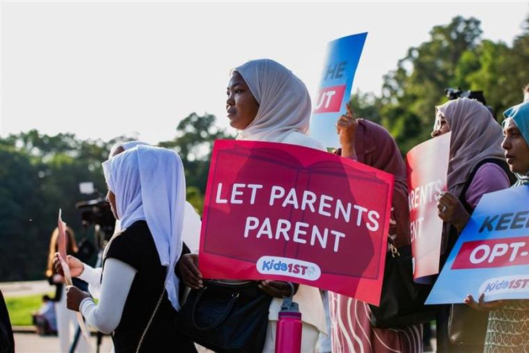 Parents protest the Montgomery County School Board's policy blocking them from opting out their children from pro-homosexual and transgender materials.