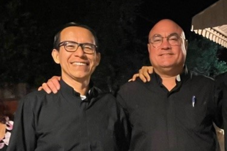 Father Rodriguez stands to the left of Father Thomas Martin, pastor and administrator of two parishes in Redwood City, Calif.