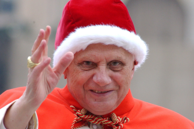 Pope Benedict XVI wears a festive hat on Dec. 21, 2005.