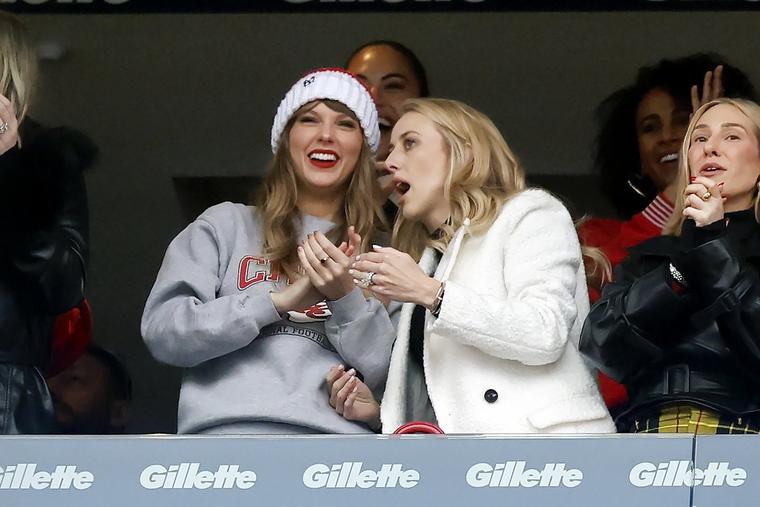 Taylor Swift, left, talks with Brittany Mahomes, right, during the first half of an NFL football game between the New England Patriots and the Kansas City Chiefs, Sunday, Dec. 17, 2023, in Foxborough, Mass.