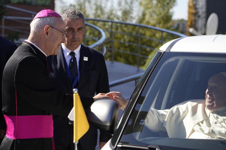 Pope Francis greets Bishop Athanasius Schneider, left, the auxiliary bishop of Astana, Kazakhstan, at the end of a meeting with priests, religious men and women, seminarians and catechists at the Our Lady Of Perpetual Help Cathedral in Nur-Sultan, Kazakhstan, Thursday, Sept. 15, 2022.