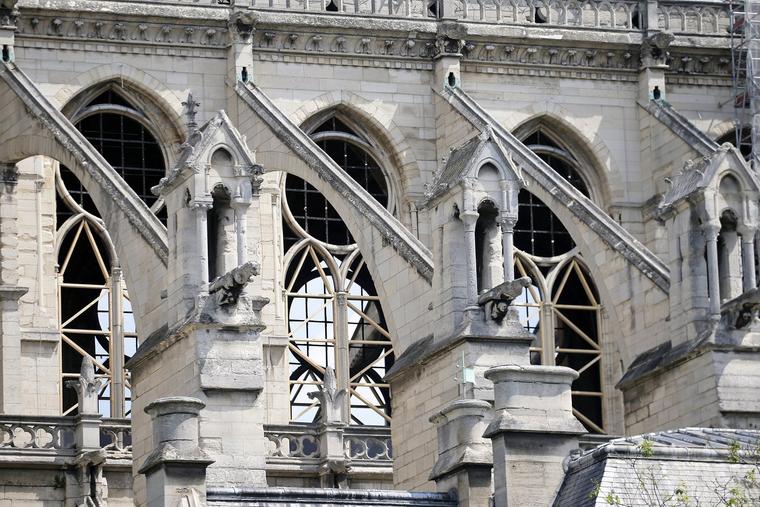 Notre Dame is seen without the stained-glass windows that were damaged in the massive 2019 fire that ravaged Paris’ famous medieval cathedral. The nave chapel windows proposed for replacement were untouched by the blaze.