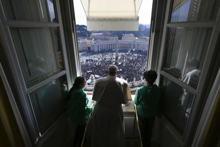 Pope Francis delivers the Sunday Angelus from the window of his study overlooking St. Peter's Square on Jan. 28.