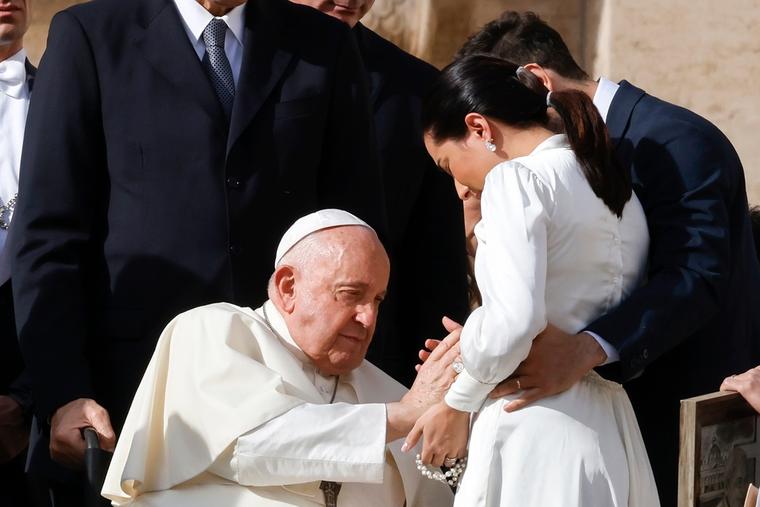 Pope Francis blesses a married couple at the end of his weekly general audience in St. Peter's Square at the Vatican, November 15, 2023.
