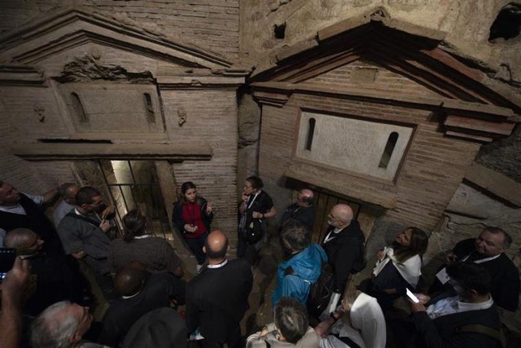 An archaeological guide provided historical information and answered questions during a visit to the catacombs by delegates of the Synod on Synodality. Early Christians gathered within the catacombs for funeral rites and to honor the martyrs. Rome, Italy. Oct. 12, 2023.
