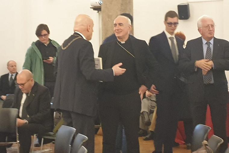 (L-R) Bishop Antonio Staglianò greeting Stefano Bisi, grand master of the Grand Orient Freemasonic Lodge, at the Ambrosianum Cultural Foundation in Milan on Feb. 16, 2024.