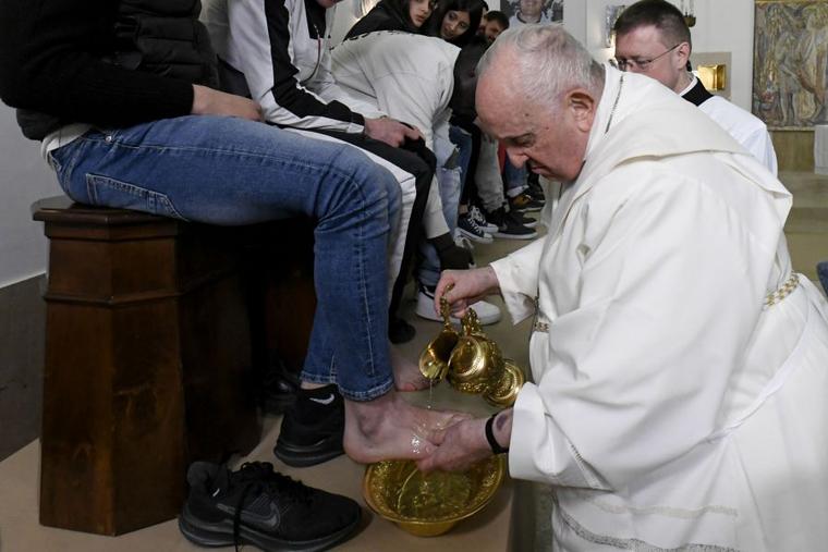 Pope Francis washes the feet of 12 young men and women, inmates at Casal del Marmo juvenile detention center on Rome’s outskirts, during a Mass of the Lord’s Supper on Thursday, April 6, 2023.