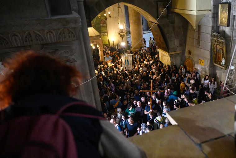 The Good Friday Via Crucis procession enters the Church of the Holy Sepulchre on March 29 in Jerusalem.