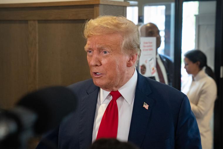 Former U.S. President Donald Trump speaks to the media during a visit to a Chick-fil-A restaurant on April 10, 2024 in Atlanta, Georgia.