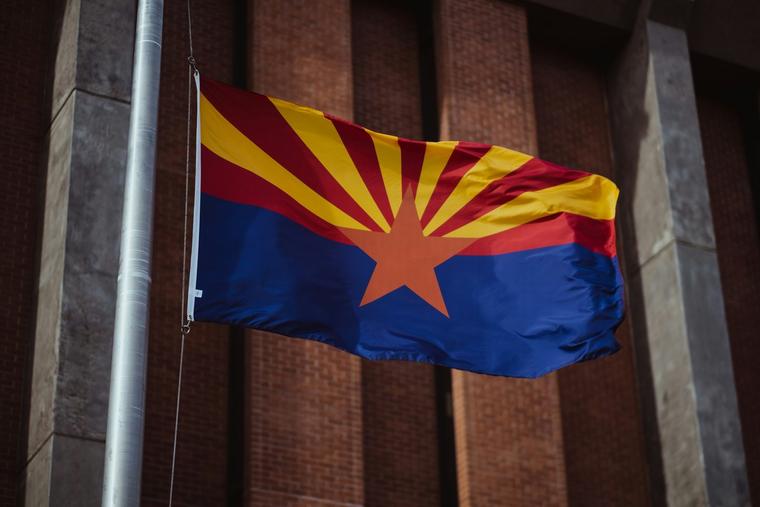Flag of Arizona flies across from Wesley Bolin Memorial Plaza, in Phoenix, the state capital.