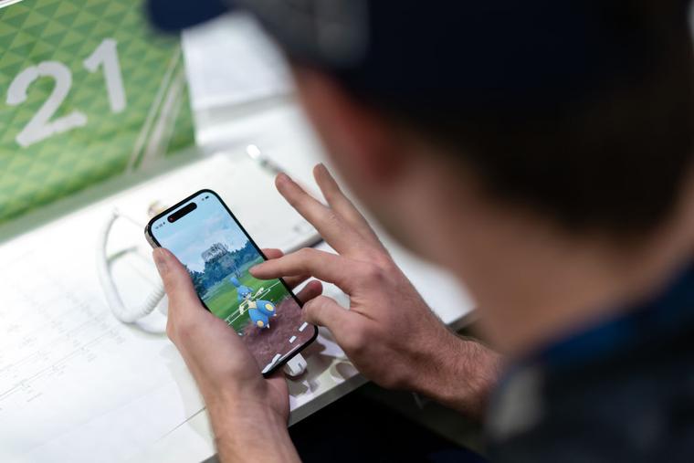 A competitor plays the Pokémon GO game during the 2023 Pokémon World Championships at the Pacifico Yokohama convention center on August 11, 2023 in Yokohama, Japan.