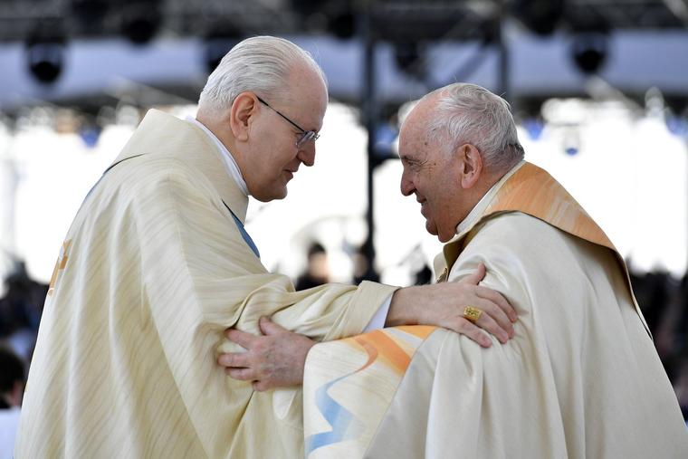 Pope Francis greets Cardinal Péter Erdő, archbishop of Budapest, during a Mass at Kossuth Lajos Square on April 30, 2023, in Budapest, Hungary.