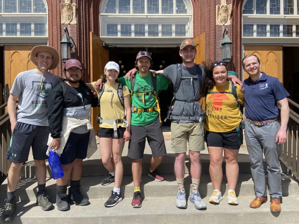 Will Peterson (far right) poses with a group of pilgrims.