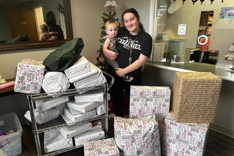 A mom receives a donation of free gifts at ABC Pregnancy Resource Center in Lake Charles, Louisiana.