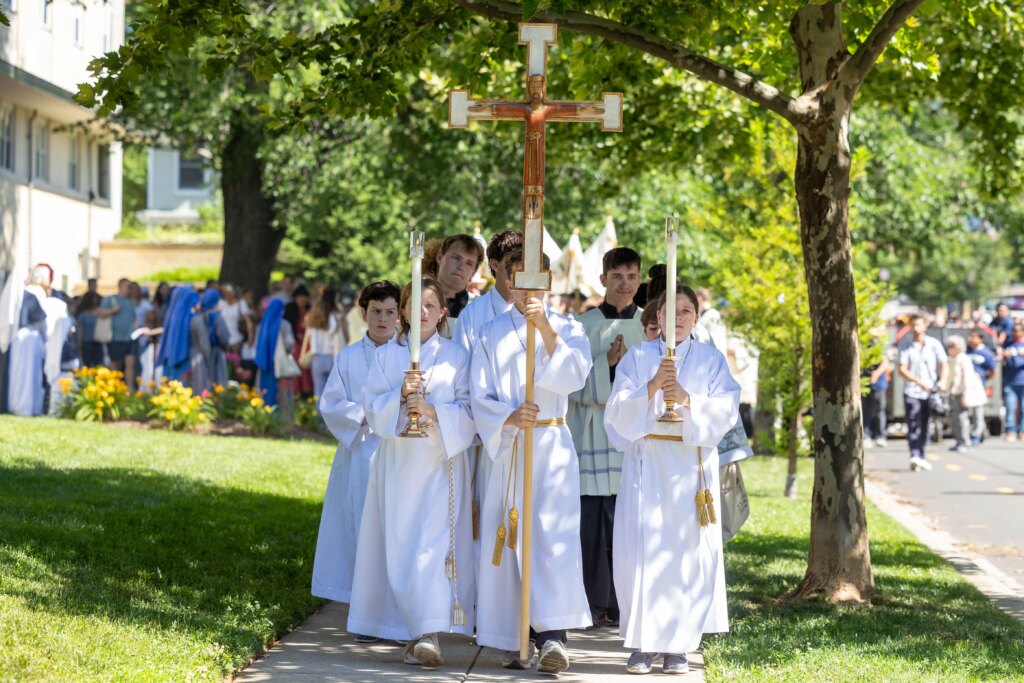 Young people lead the way as the procession travels through