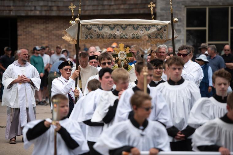 The Blessed Sarament processes down a street in Nebraska.