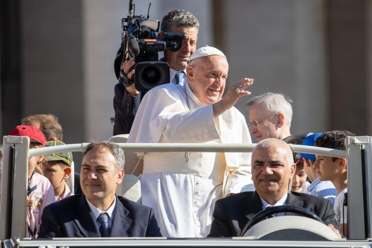Pope Francis waves to pilgrims at his General Audience in St. Peter's Square at the Vatican, Wednesday, June 26, 2024