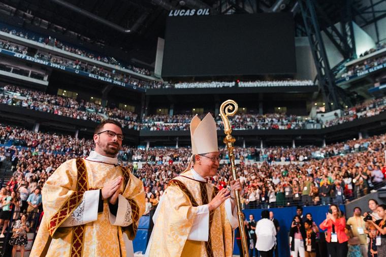 Cardinal Luis Tagle waves at pilgrims during the National Eucharistic Congress July 21, 2024.