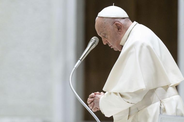 Pope Francis prays during his general audience on Wednesday, May 1 in Paul VI Hall at the Vatican.