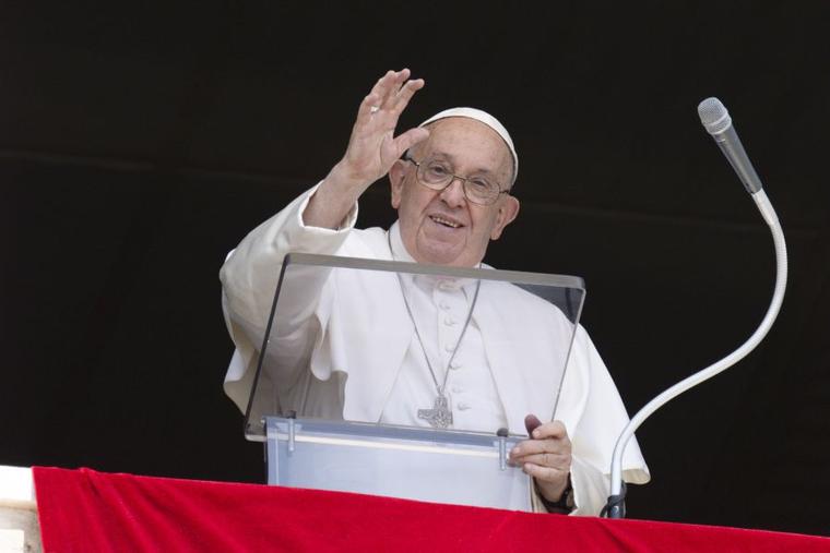 Pope Francis waves to pilgrims gathered in St. Peter's Square for his Angelus address on Aug. 4, 2024.