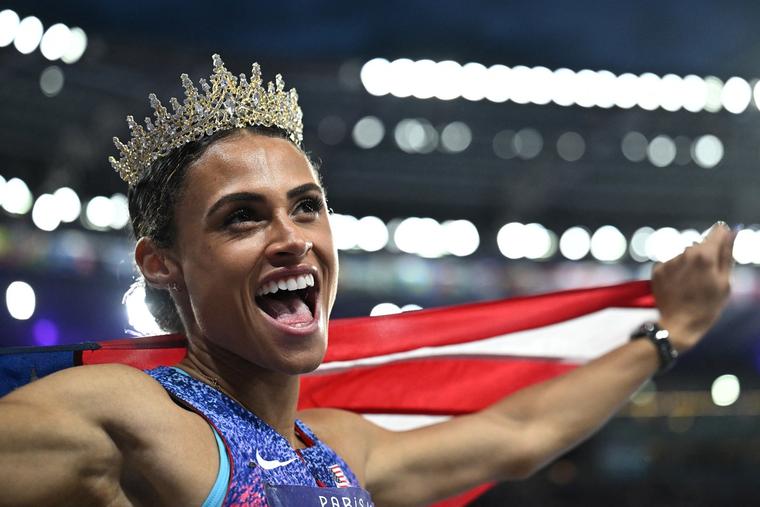 American gold medalist Sydney McLaughlin-Levrone wears a crown as she celebrates winning the women’s 400m hurdles final of the athletics event and setting a new world record during the Paris 2024 Olympic Games at Stade de France in Saint-Denis, north of Paris, on Aug. 8.