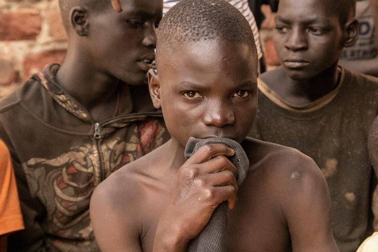 Youth — street kids in Kampala, Uganda, are shown — are particularly vulnerable to the ideologies of Western aid groups working in Africa; various groups aim to normalize homosexual tendencies among African youth.