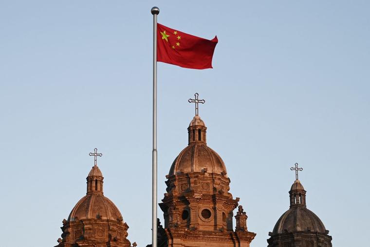 The Chinese national flag flies in front of St Joseph's Church, also known as Wangfujing Catholic Church, in Beijing on October 22, 2020.