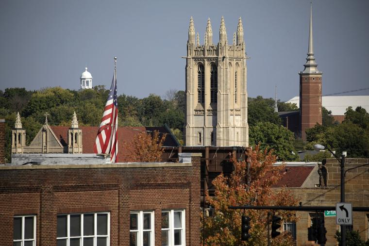 A U.S. flag flies on Sept. 16 amid the cityscape in Springfield, Ohio.