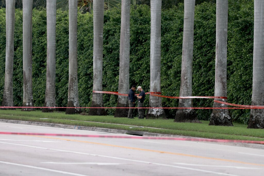 Law enforcement personnel investigate the area around Trump International Golf Club after an apparent assassination attempt of former President Donald Trump on September 15, 2024 in West Palm Beach, Florida. Credit: Joe Raedle/Getty Image