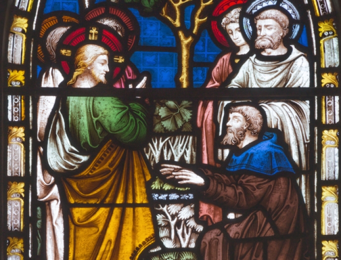 Detail on stained glass showing Jesus healing Bartimaeus in St. Mary Abbot's Church on Kensington High Street in London.