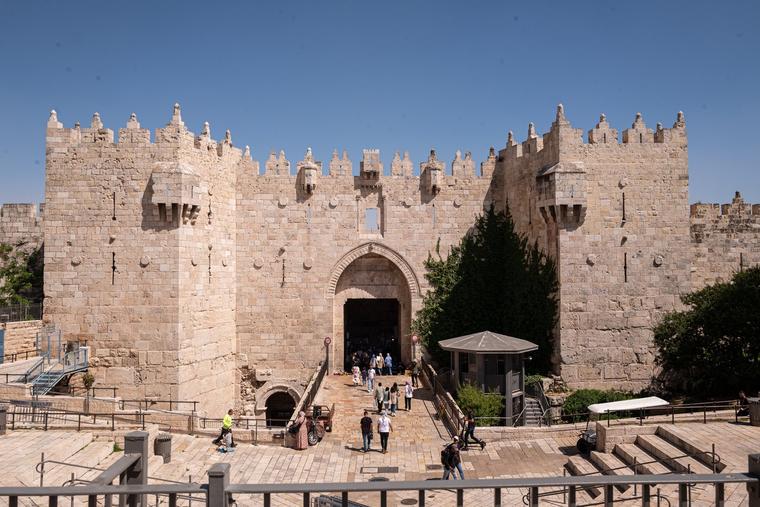 People enter the Damascus gate at the old city of Jerusalem on June 10 in Jerusalem, amid Israel’s war against Hamas in Gaza.