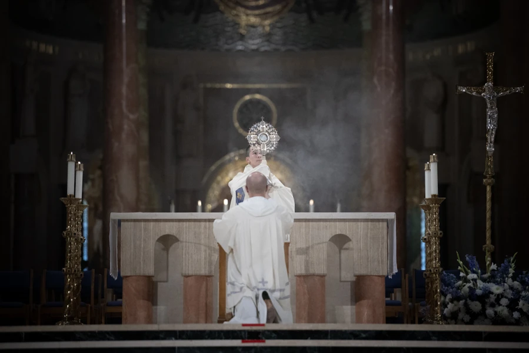 A Dominican friar blesses the faithful with the Eucharist during Benediction at the Dominican Rosary Pilgrimage at the National Shrine of the Immaculate Conception in Washington, DC, on Sept. 28, 2024.