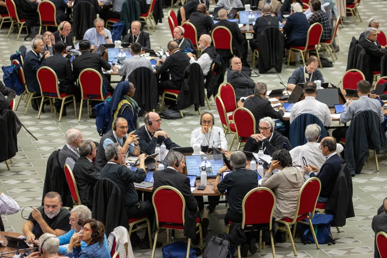 Delegates at the 2024 Synod on Synodality participate in roundtable meetings on Oct. 10, 2024, in the Paul VI Hall at the Vatican.