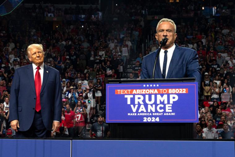 Former presidential candidate Robert F. Kennedy Jr. (R) speaks as Republican presidential nominee, former U.S. President Donald Trump listens during a campaign rally at Desert Diamond Arena on August 23, 2024 in Glendale, Arizona.