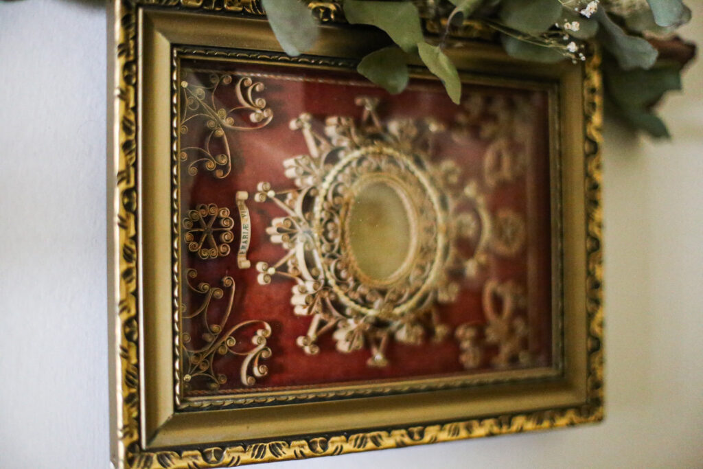 Agnus Dei relic adorns the wall of a home.