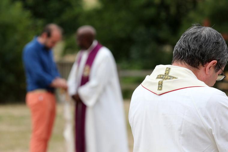 Priests hear confessions at the Shrine of St. John Vianney in Ars-sur-Fromans, France