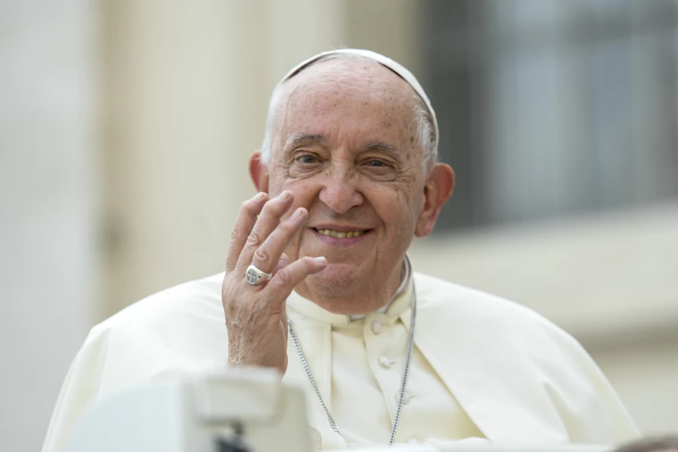 Pope Francis waves to pilgrims at his Wednesday general audience in St. Peter’s Square at the Vatican on Oct. 9, 2024.