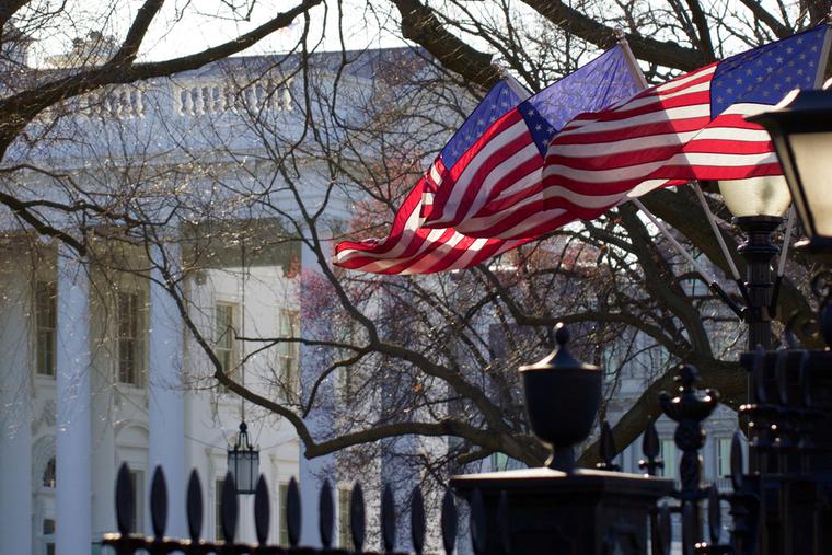 Flags fly outside the White House in Washington, D.C.