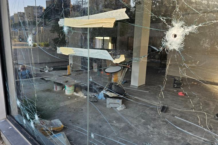 Broken glass and empty streets are seen in Kiryat Shmona, Israel, after months of rocket fire from Hezbollah.