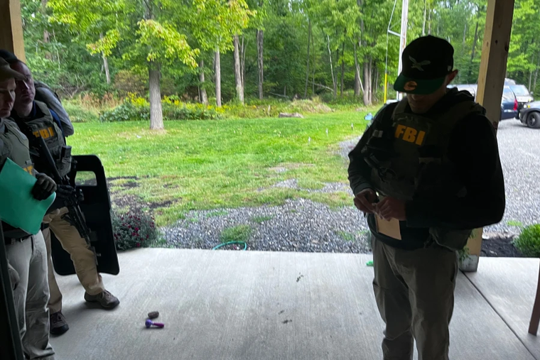 An FBI agent stands outside the Houck residence in Kintnersville, Pennsylvania, on Sept. 23, 2022. Mark Houck was arrested that day and charged with assaulting a Planned Parenthood escort outside an Philadelphia abortion clinic on Oct. 13, 2021.